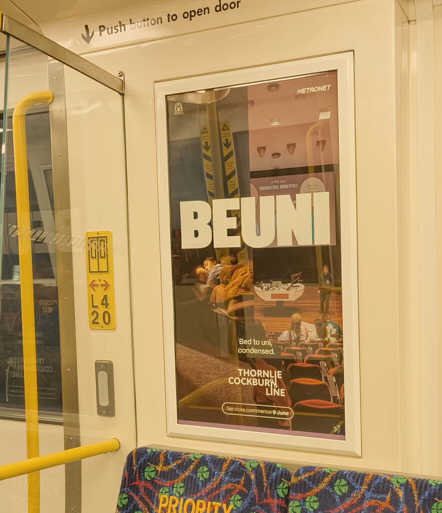 Original BEUNI poster inside a Transperth train
