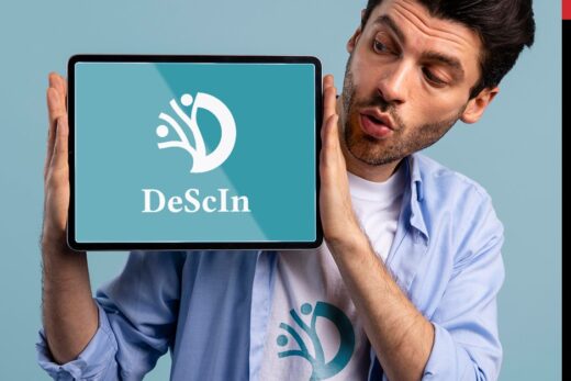 A man holding an iPad showing the winning logo design of DeScIn.