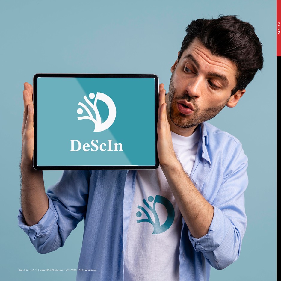 A man holding an iPad showing the winning logo design of DeScIn