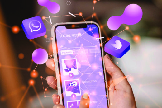 Photo showing social media icons around a mobile phone