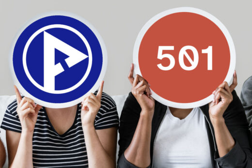 Two people holding up circular signs showing Perth Digital A11y Group's logo and the number 501
